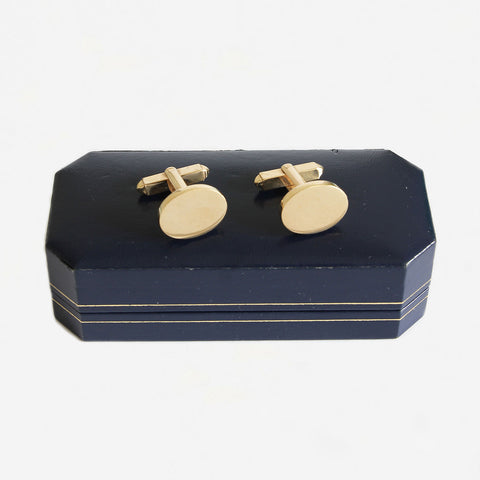 a secondhand pair of 9 carat yellow gold plain oval solid cufflinks with t bar fitting