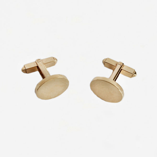 a pair of yellow gold oval plain solid cufflinks with bar fittings and box