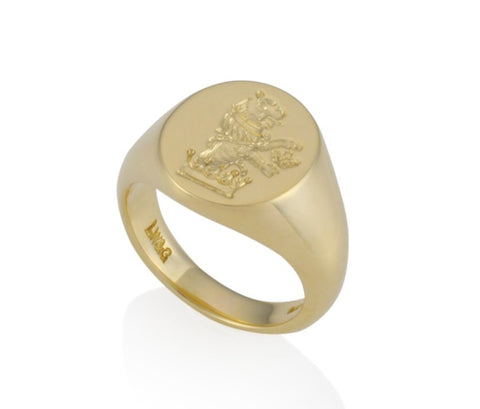 a gold oval signet ring 16mm x 13mm