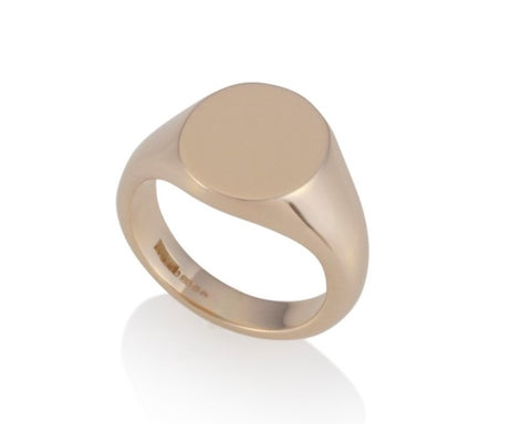 a gold oval signet ring 13.5mm x 11.5mm