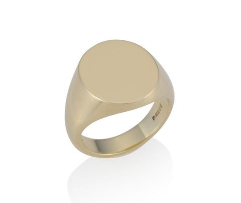 a gold oval signet ring 19mm x 16mm