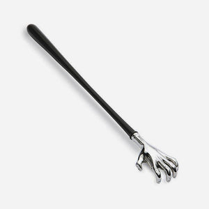 a novelty back scratcher made from sterling silver and an ebony handle with a hand design