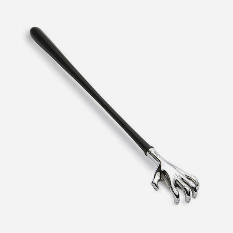 a novelty back scratcher made from sterling silver and an ebony handle with a hand design