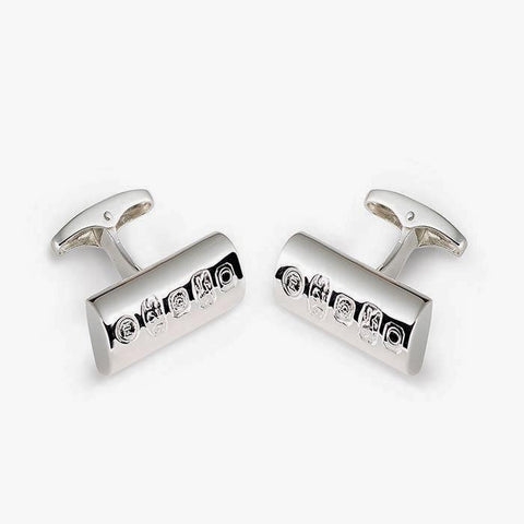 a set of modern silver cufflinks with a half pipe shape and post fitting with the hallmark on the front