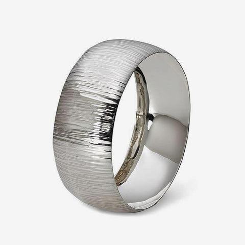 a men's sterling silver bangle which is wide and has a bark pattern throughout