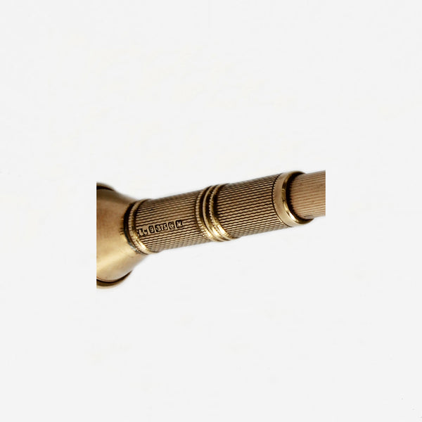 a preowned yellow gold cigar cutter with hallmark