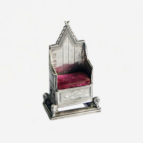 a silver miniature coronation chair pin cushion