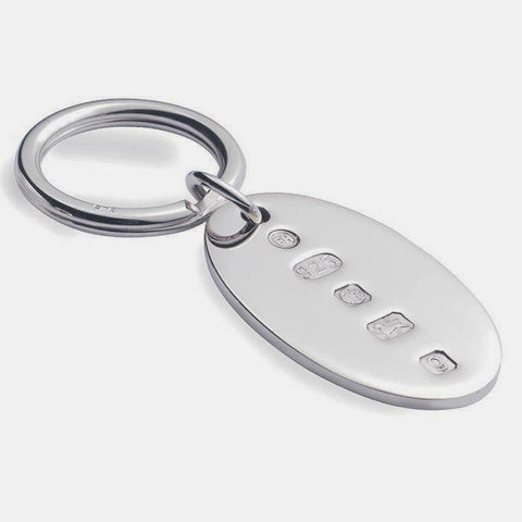 a silver hallmarked oval heavy solid key ring modern