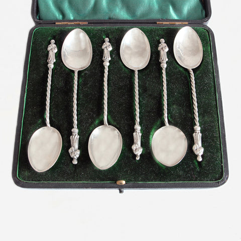 a set of secondhand silver apostle spoons in a green box dated 1901