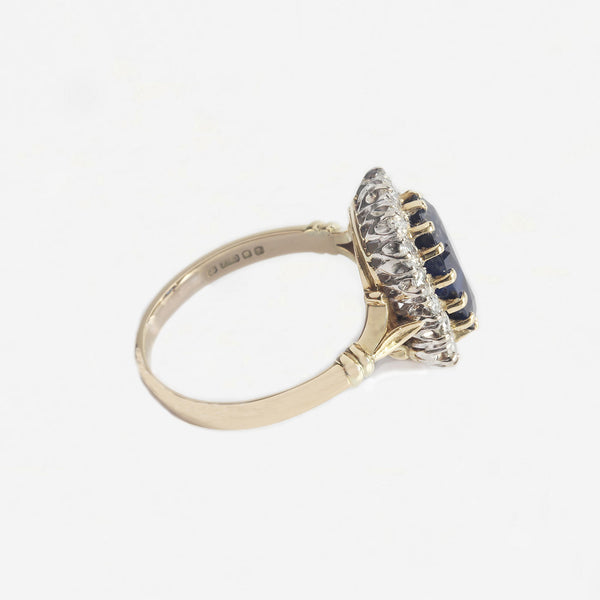 a beautiful secondhand oval claw set sapphire and diamond ring