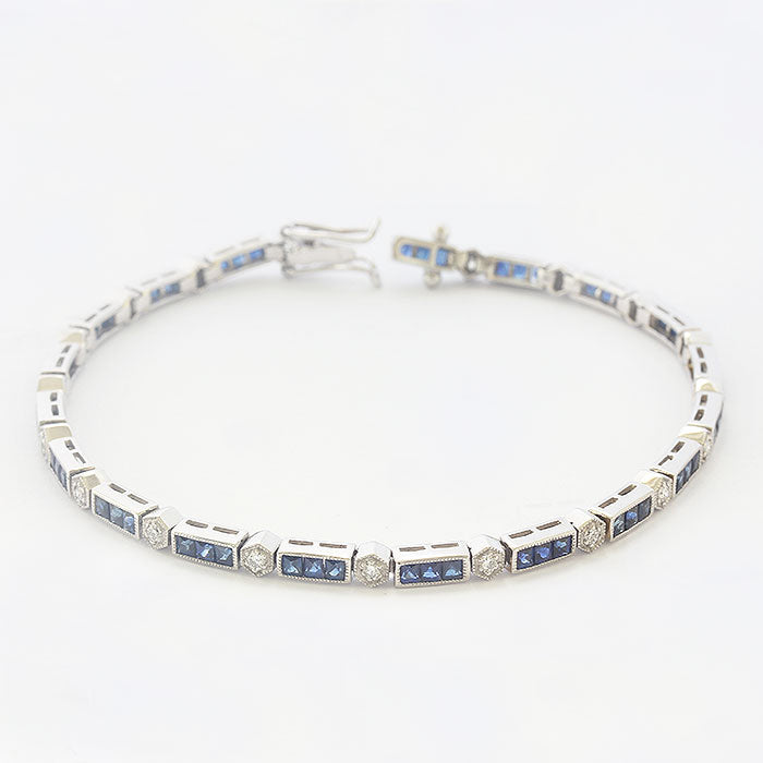 A French cut Sapphire and brilliant cut diamond bracelet in Platinum. With a concealed box snap clasp