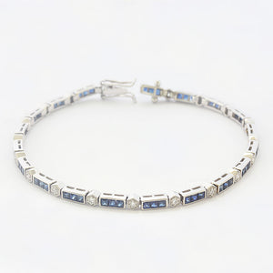 A French cut Sapphire and brilliant cut diamond bracelet in Platinum. With a concealed box snap clasp