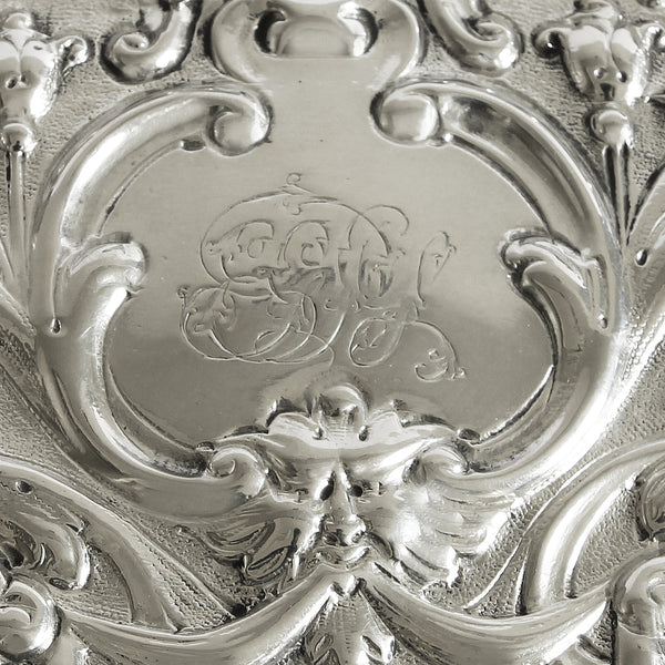 a preowned silver oval birds and flowers design tray with raised edge dated 1893