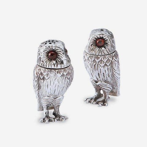 a sterling silver set of salt and pepper in an owl design 