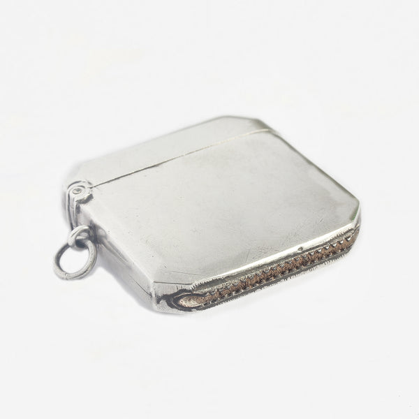 a silver vesta case with plain design and 8 sides and hallmarked 1913