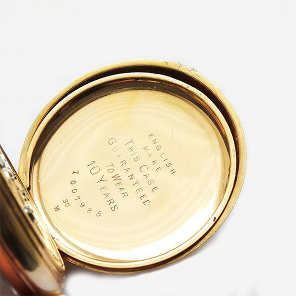 a preowned gold plate pocket watch open faced by kendal and dent with 19 jewels and original box