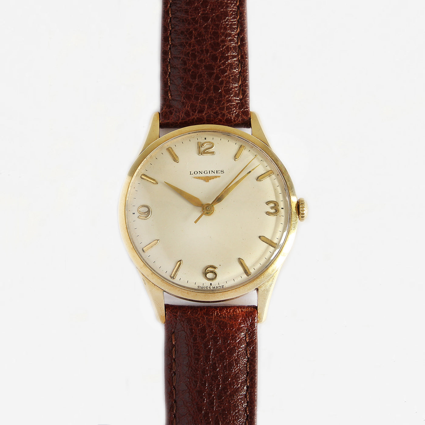 a secondhand longines gents watch with leather strap and gold dial