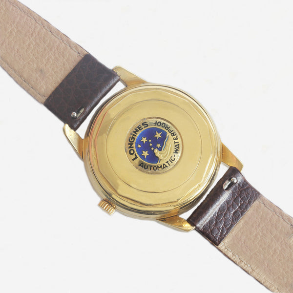 a secondhand mens longings watch with gold case and dated 1950s