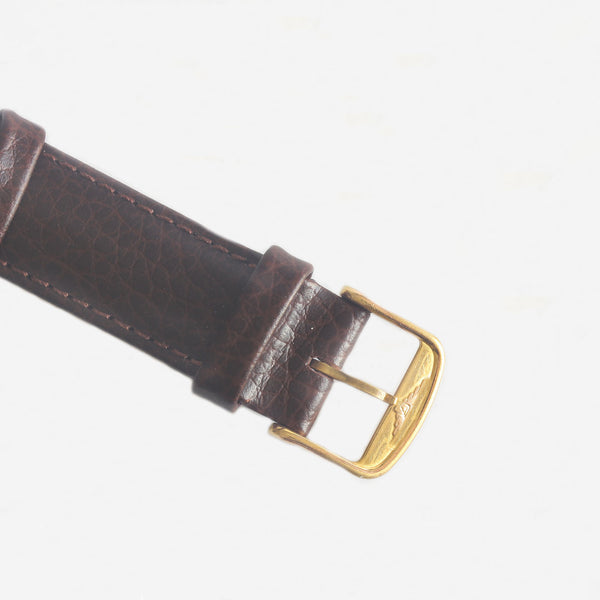 a fine quality buckle on a leather and gold mens longings watch