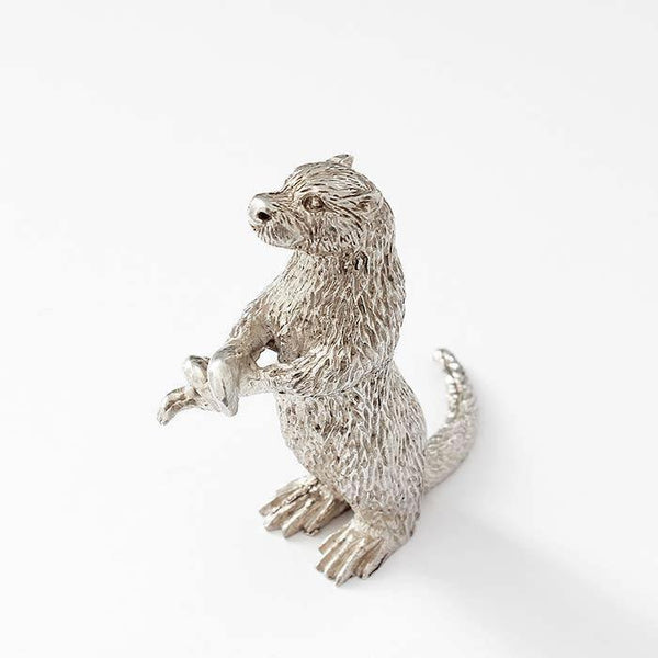 a fine quality large sterling silver otter figure holding an eel with a full british hallmark