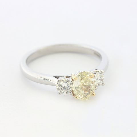 diamond 3 stone ring with central yellow diamond all in platinum