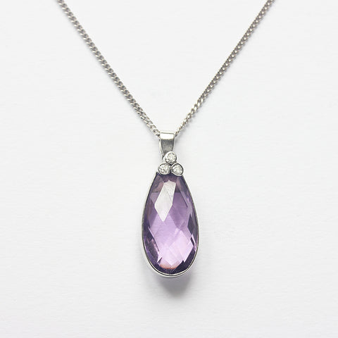 a beautiful amethyst and diamond pendant in white gold with a curb link necklace