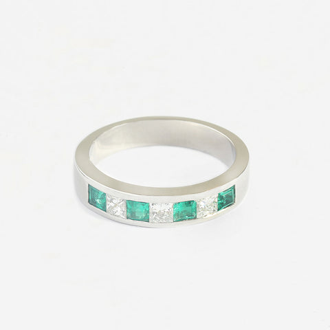 a platinum square emerald and diamond half eternity ring