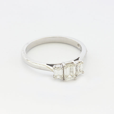 a platinum diamond set 3 stone ring with a claw setting
