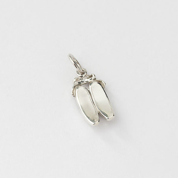 silver ballet shoes charm with bow at the top