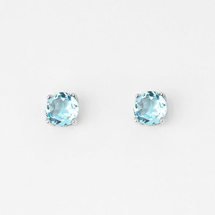 blue topaz round stud earrings with 4 claw settings and set in silver