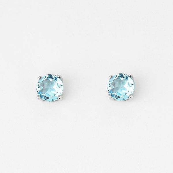 blue topaz round stud earrings with 4 claw settings and set in silver