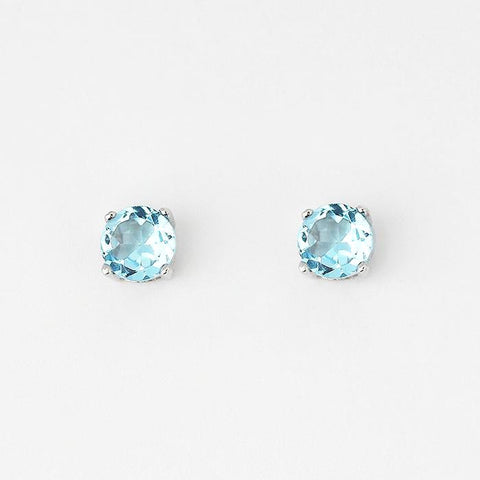 blue topaz round stud earrings with 4 claw settings and set in silver