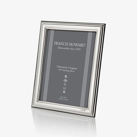 silver photo frame with a plain ribbed edge and black wooden finish at the back english made