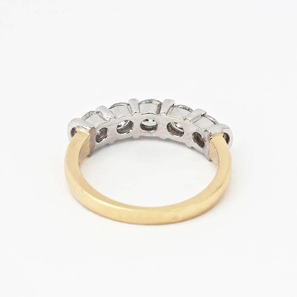 diamond set half eternity ring with 5 round stones and a white gold bar setting with yellow band