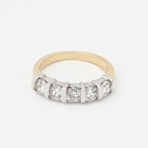 diamond set half eternity ring with 5 round stones and a white gold bar setting with yellow band