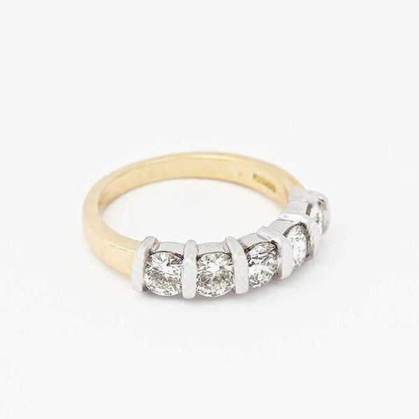 diamond set half eternity ring with 5 round stones and a white gold bar setting with yellow band