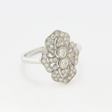 a beautiful cluster art deco style ring in white gold