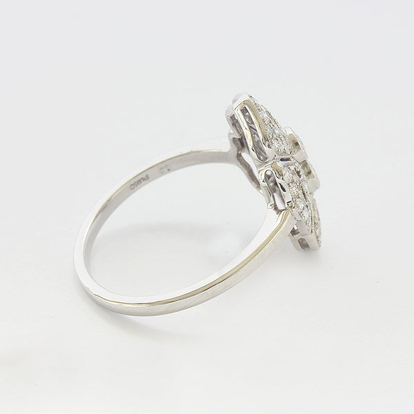 a white gold art deco cluster design ring with diamonds