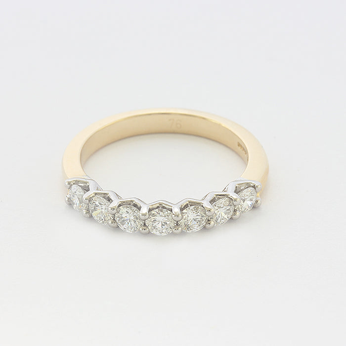 diamond set half eternity ring in 18 carat gold with 7 stones