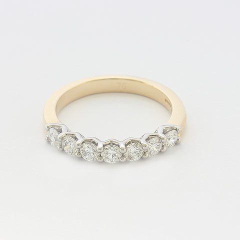 diamond set half eternity ring in 18 carat gold with 7 stones