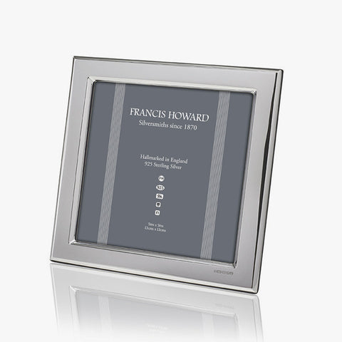 silver photo frame which is square in shape and plain edge with wooden back