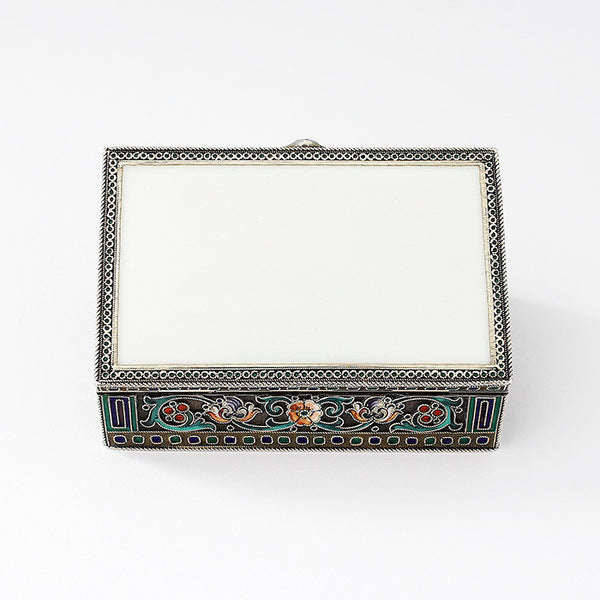 a silver gilt and enamel small trinket box with floral pattern and raised rope borders