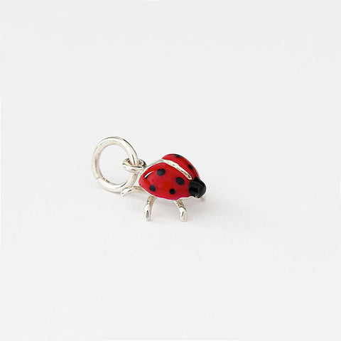 silver ladybird charm with red and black enamel