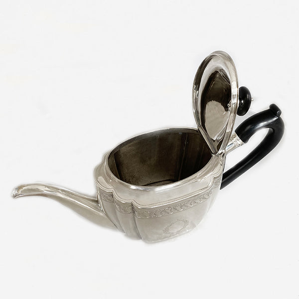 a superb antique george third silver teapot dated London 1800 with family crest lion anchor