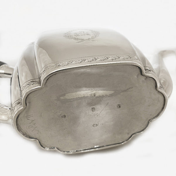 a george the third silver teapot with family crest dated London 1800