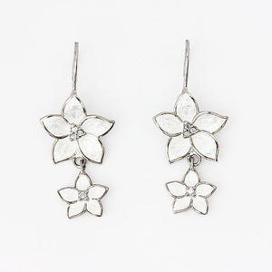 silver flower drop earrings with hook fittings and white enamel petals with small diamonds in the centre