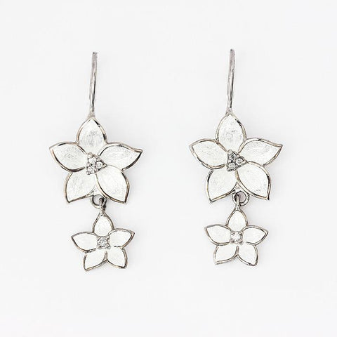 silver flower drop earrings with hook fittings and white enamel petals with small diamonds in the centre