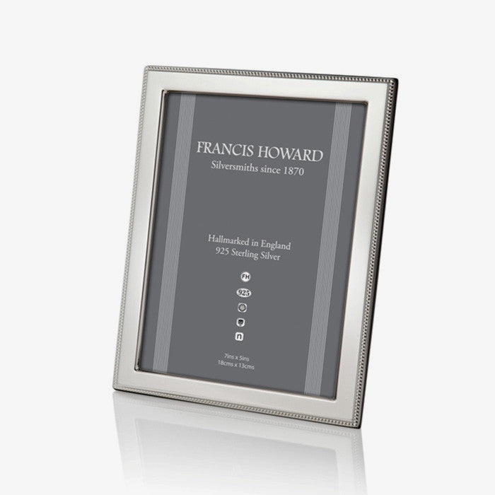 silver photo frame with a outer beaded edge and a wooden back made in sheffield