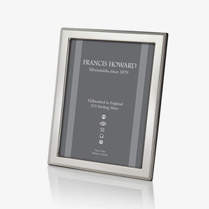 silver photo frame with a outer beaded edge and a wooden back made in sheffield