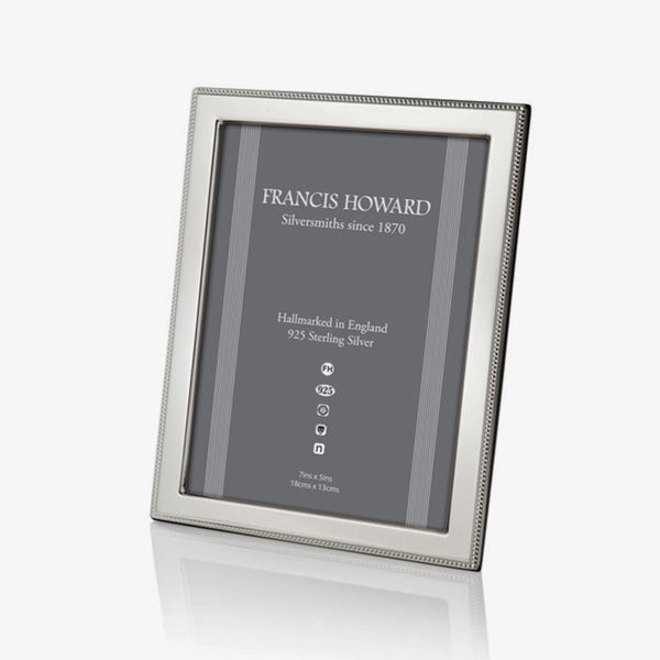 silver photo frame with a outer beaded edge and a wooden back made in sheffield